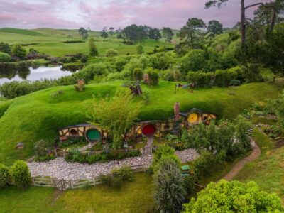 From Auckland: Hobbiton Movie Set Day Tour with Picnic Lunch - Entering Hobbiton: 12 acres, 44 hobbit holes, and the details that matter